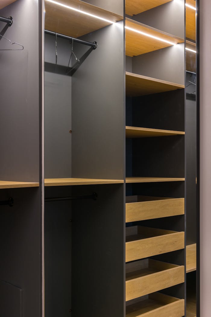 Minimalist modern wardrobe with empty shelves and hangers, perfect for organization.